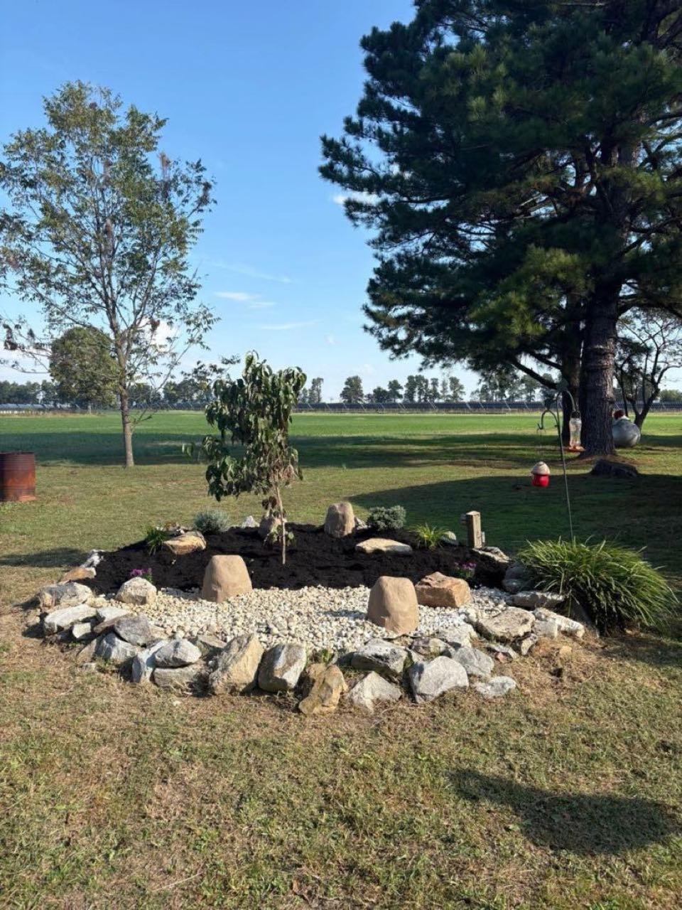 Stone rock garden island with new plantings